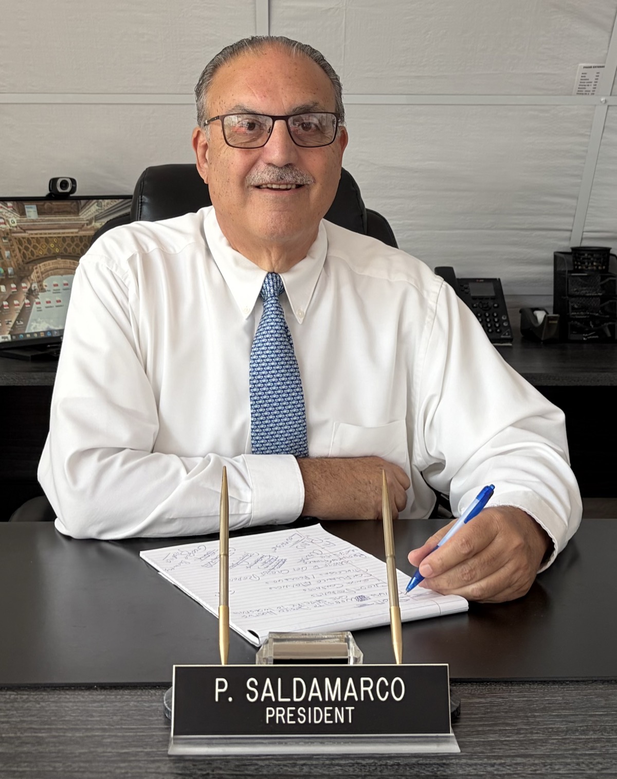 Peter Saldamarco at his desk at P. Saldamarco, LLC